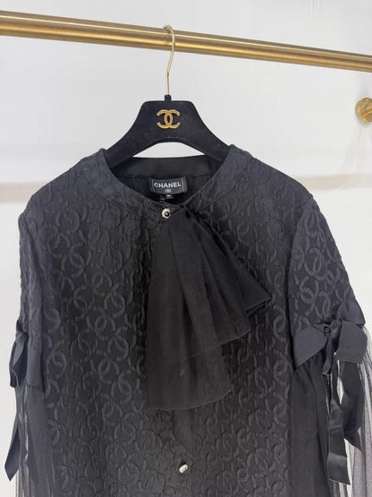 Chanel 25K black blouse