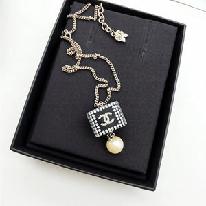 CHANEL acrylic dice pearl pendant necklace,