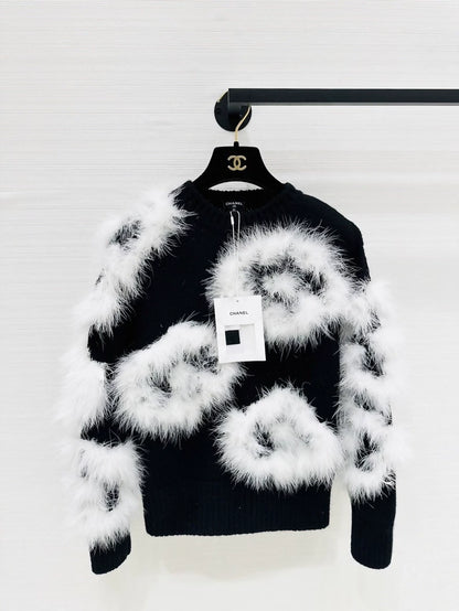 Chanel 23K black and white knit top