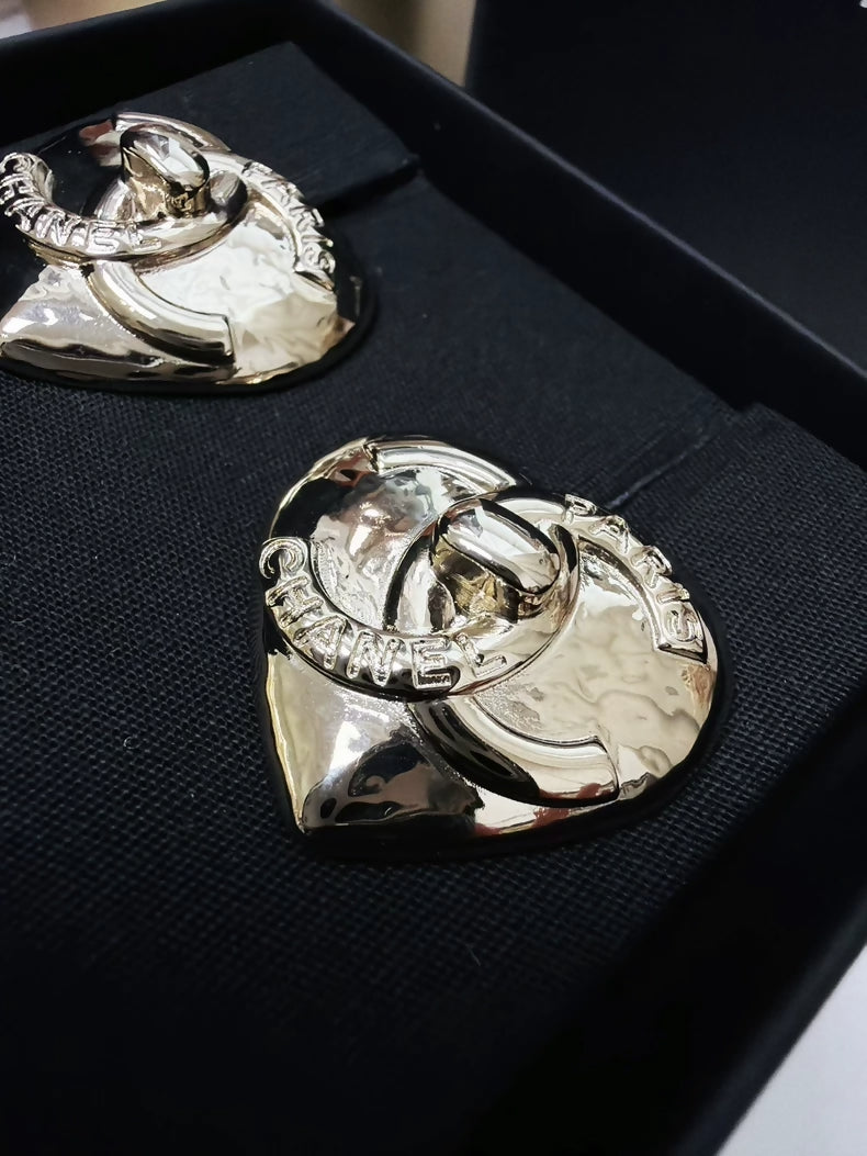 Chanel 22 light gold heart-shaped backpack clasp metal earrings