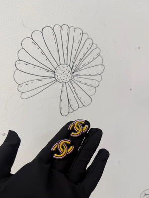 Chanel 23A comic-style double C earrings