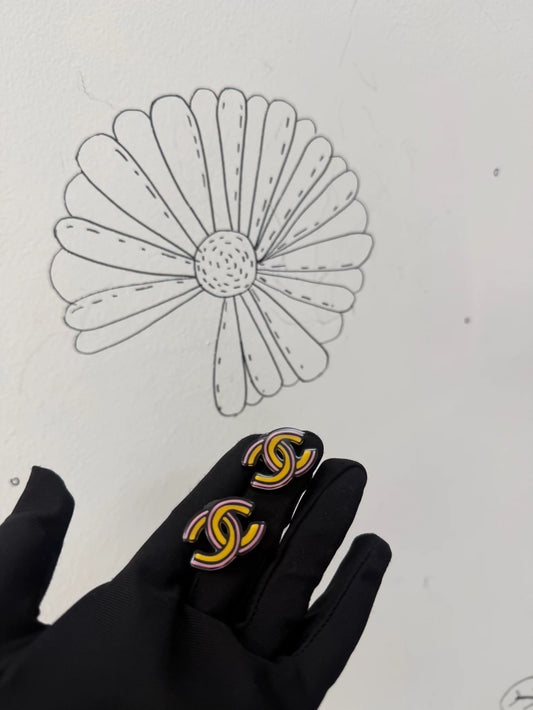 Chanel 23A comic-style double C earrings