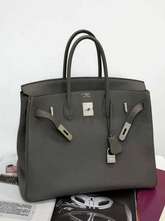 Hermès Birkin handbag in dark taupe grey grained leather with brushed palladium hardware, twin rolled handles and clochette