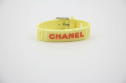 Chanel Vintage 99P Rubber Yellow with Orange Lettering Bracelet