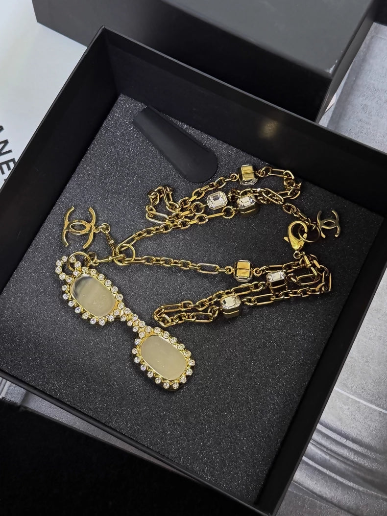 Chanel 24s gold-plated sunglasses-style long chain necklace