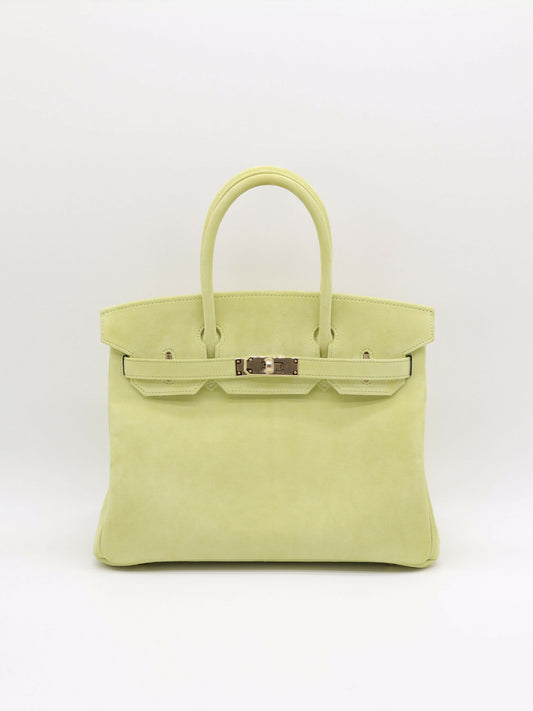 Hermès Birkin handbag in pale lime green suede with gold hardware, twin rolled handles and front turn-lock strap closure