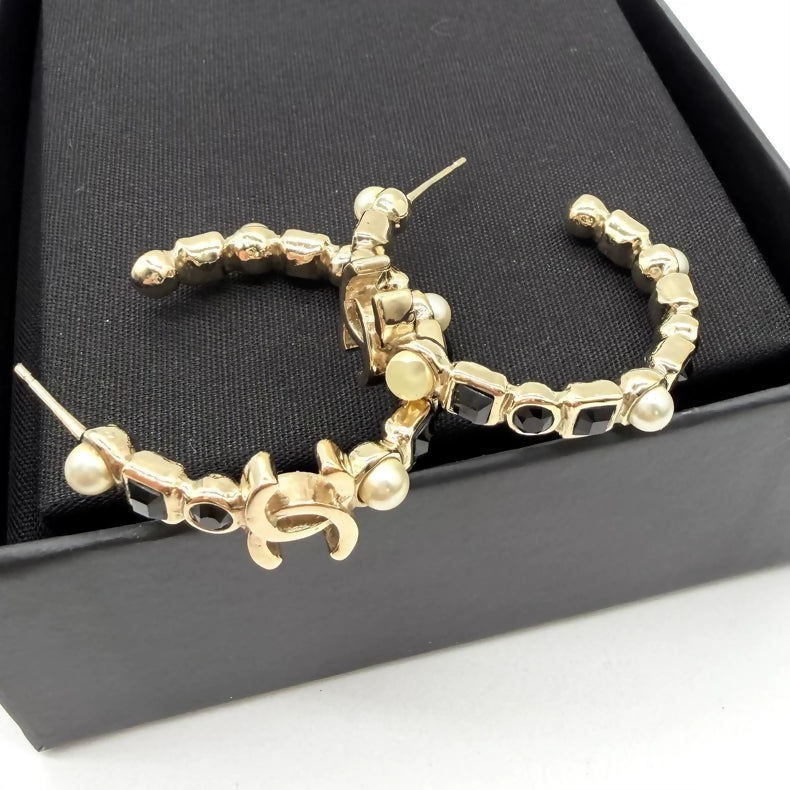 Chanel black diamond and pearl hoop earrings