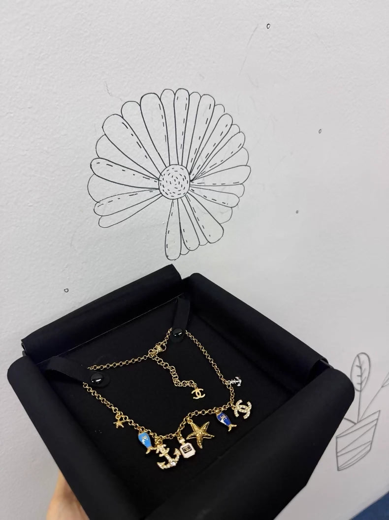 Chanel 25C Ocean Fish and Starfish charm Necklace