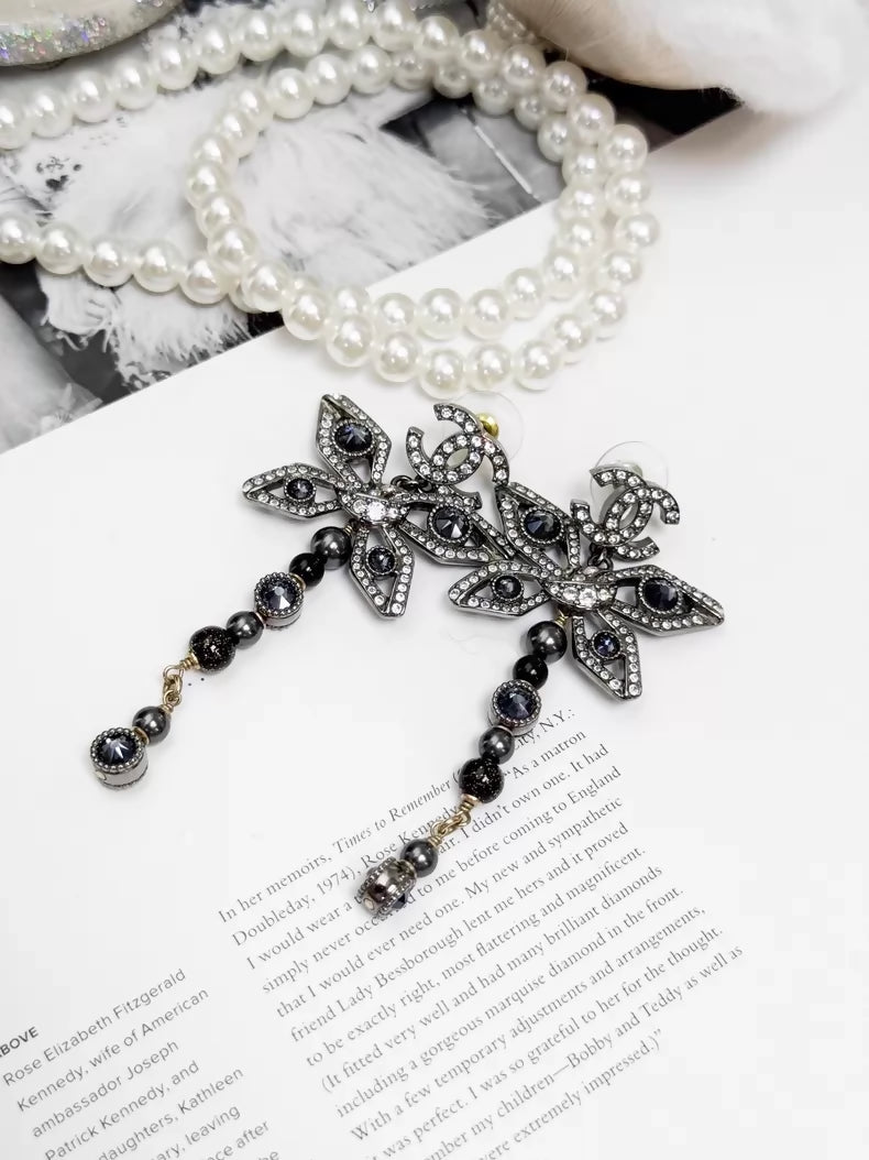 Chanel Métiers d'Art silver butterfly long stud earrings