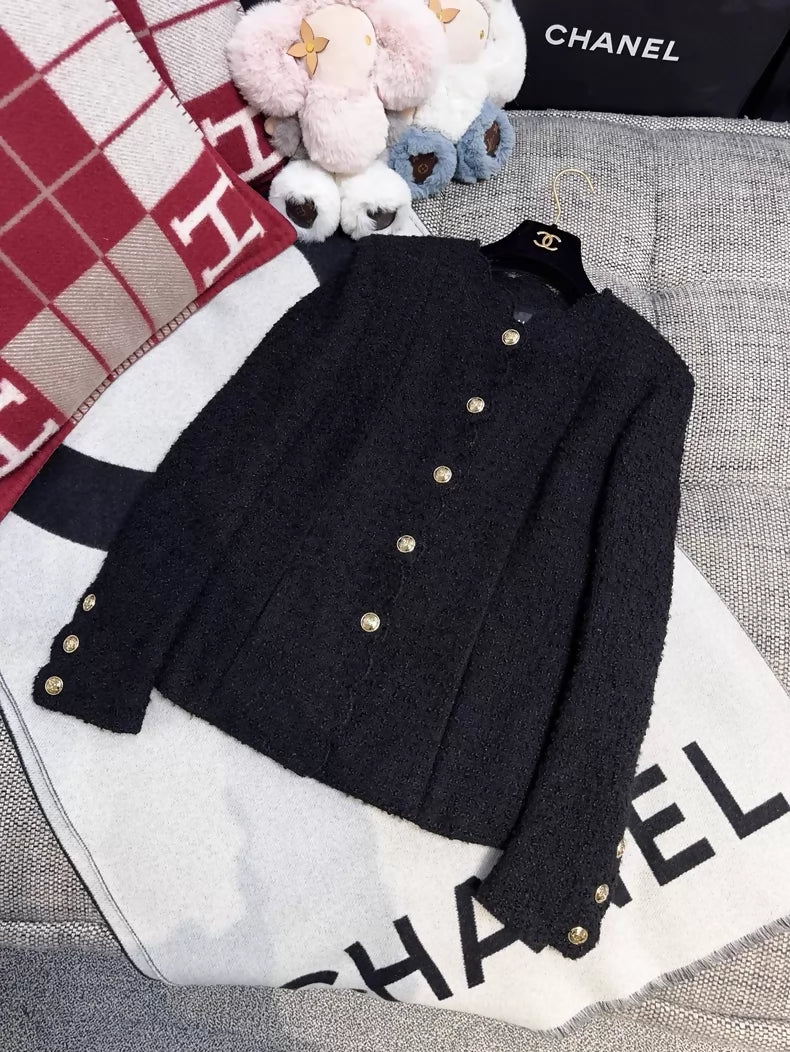 Chanel 20k black tweed jacket