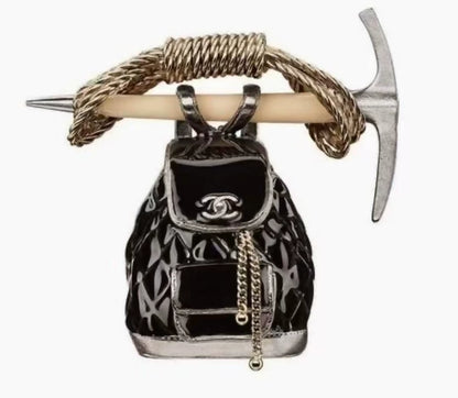 Chanel 2015 backpack and hoe brooch