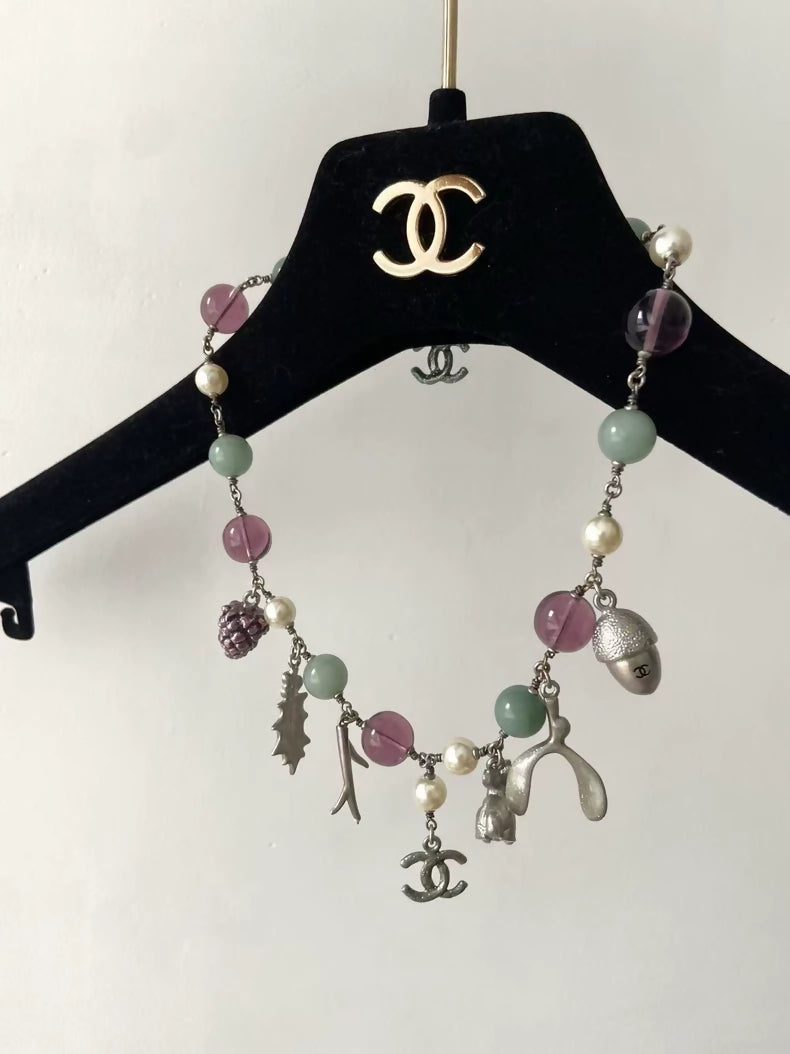 Chanel purple and green glass beaded bunny and pine cone necklace