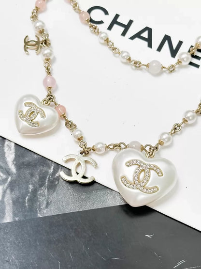 Chanel 21B Gold and pink heart-shaped pearl necklace/waist chain/sweater chain
