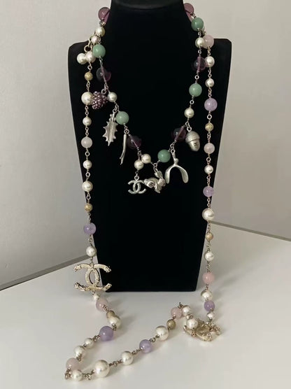 Chanel purple and green glass beaded bunny and pine cone necklace