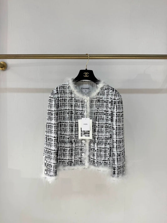 Chanel 25S black and white tweed jacket with feather trim