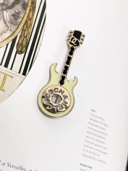 Chanel 24A enamel leather chain guitar-shaped brooch