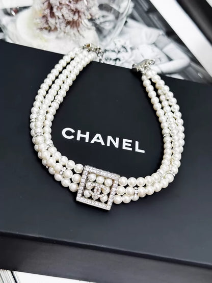 Chanel 24S pearls necklace with square rhinestones and a double-C logo