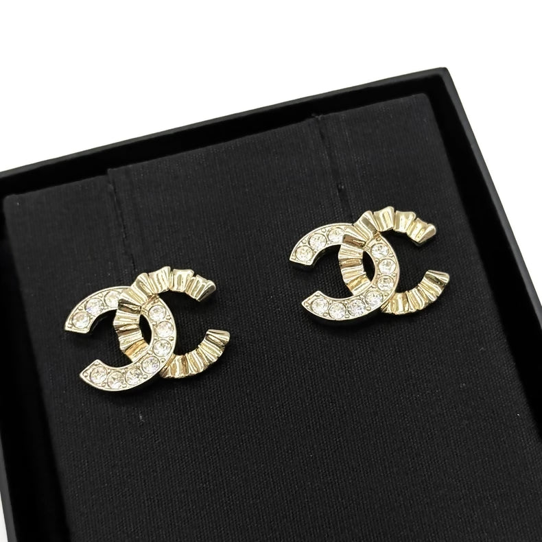 Chanel sparkling diamond wave double C earrings
