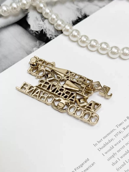 Chanel 22B  gold openwork logo brooch