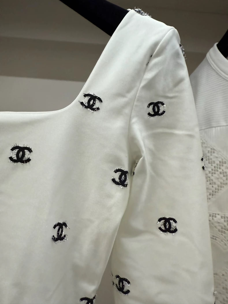 Chanel 21k white top with black cc logos