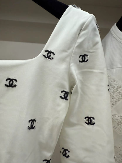Chanel 21k white top with black cc logos