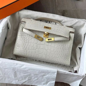 Hermès Kelly pochette Betton matte crocodile leather with gold hardware