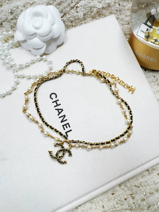 Chanel 24K gold leather chain double C pearl necklace