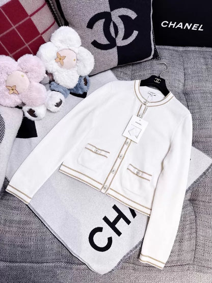 Chanel 26c white knit cardigan with gold trim and two pockets