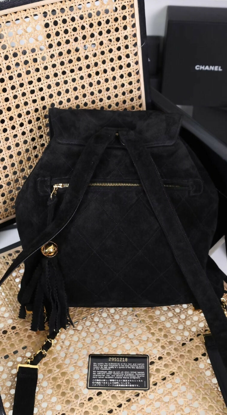Chanel black sued backpack with gold hardware