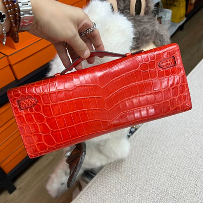 Hermès Kelly Cut D5 red shiny crocodile palladium hardware