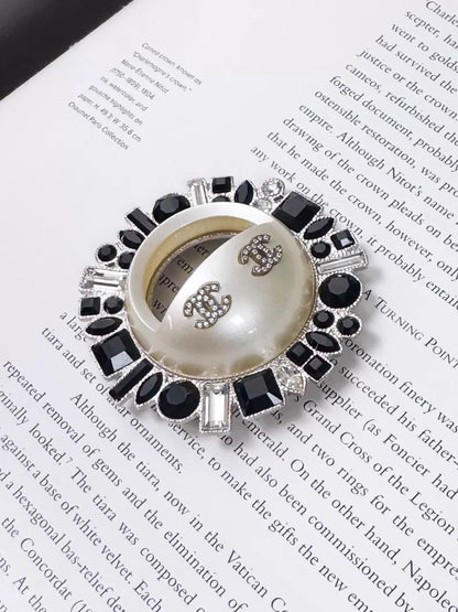 Chanel 16K black and white double C sunflower brooch