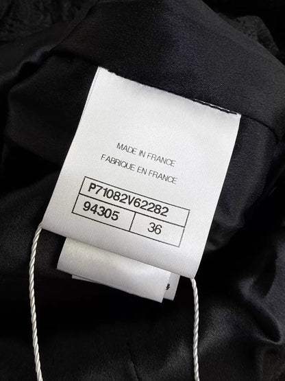 Chanel 21A Black Embossed Long Coat with Ruffled Collar