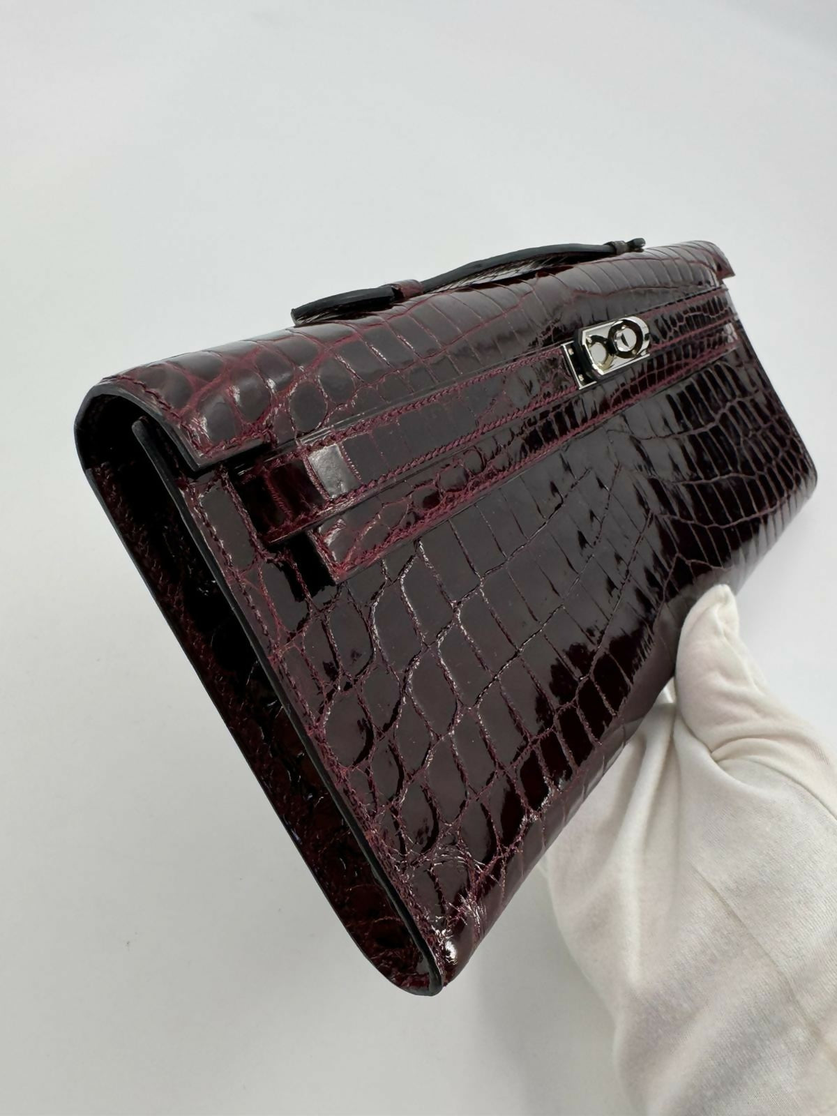 Hermès Kelly Cut Bag in Bordeaux Shiny Porosus Crocodile Leather with PHW
