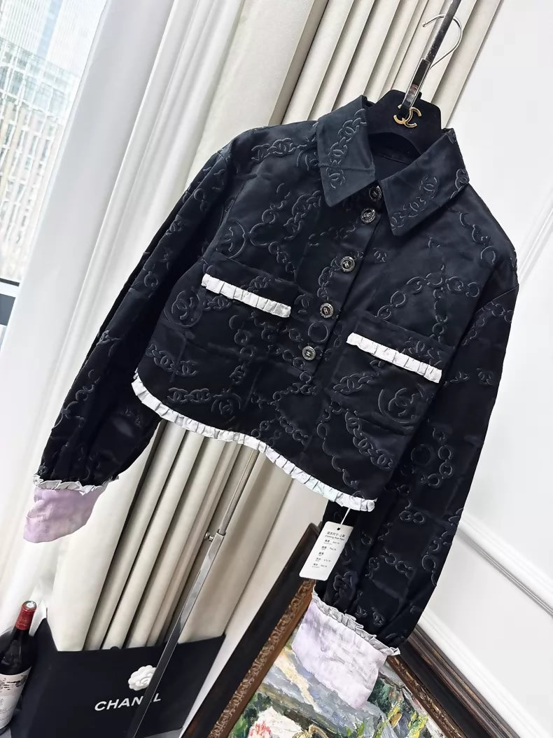 Chanel 22s black embossed double C logo jacket with purple gradient silk trim and two pockets
