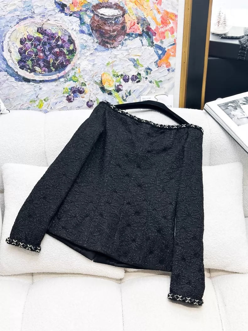 Chanel 21A black off-the-shoulder tweed jacket