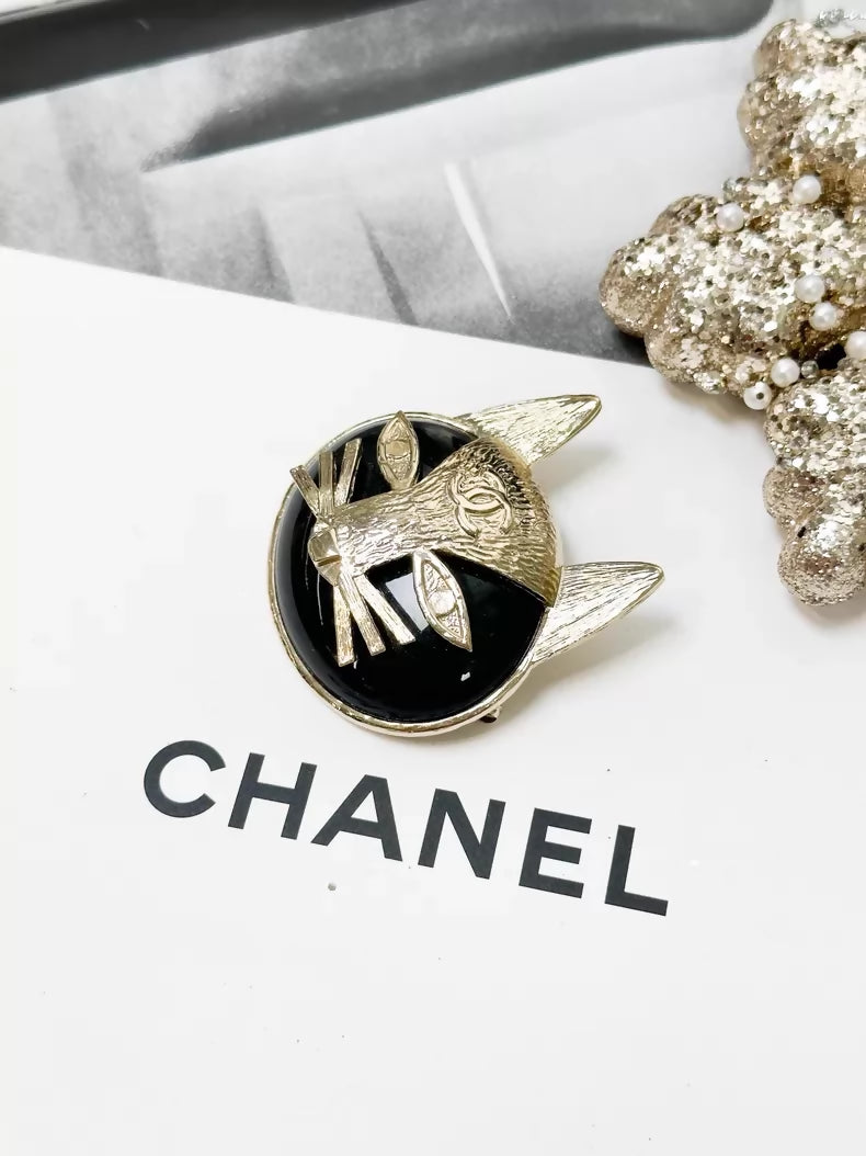 Chanel 19A black and gold double C logo cat brooch