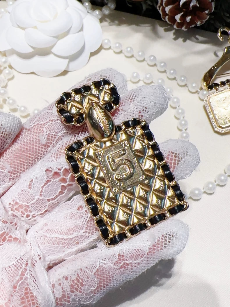 Chanel 23A quilted chain perfume bottle brooch