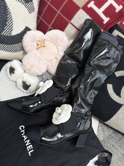 Chanel 23k black patent leather boots