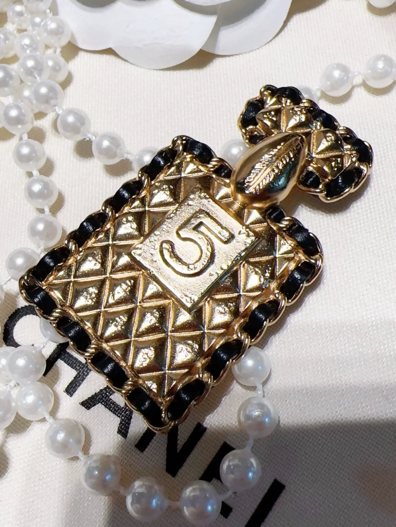 Chanel 23A quilted chain perfume bottle brooch