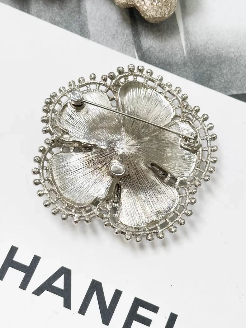 Chanel Fall/Winter 2023 black and silver pearl double C logo camellia brooch