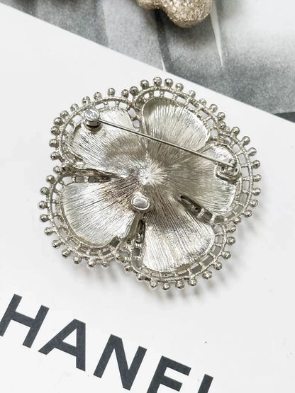 Chanel Fall/Winter 2023 black and silver pearl double C logo camellia brooch