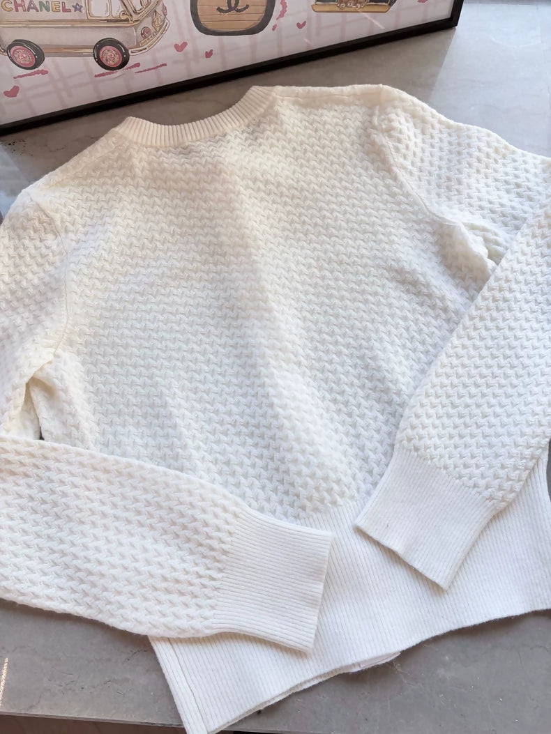 Chanel 24A white cashmere cardigan with charms buttons