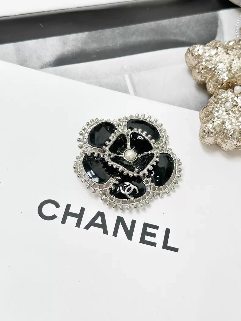 Chanel Fall/Winter 2023 black and silver pearl double C logo camellia brooch