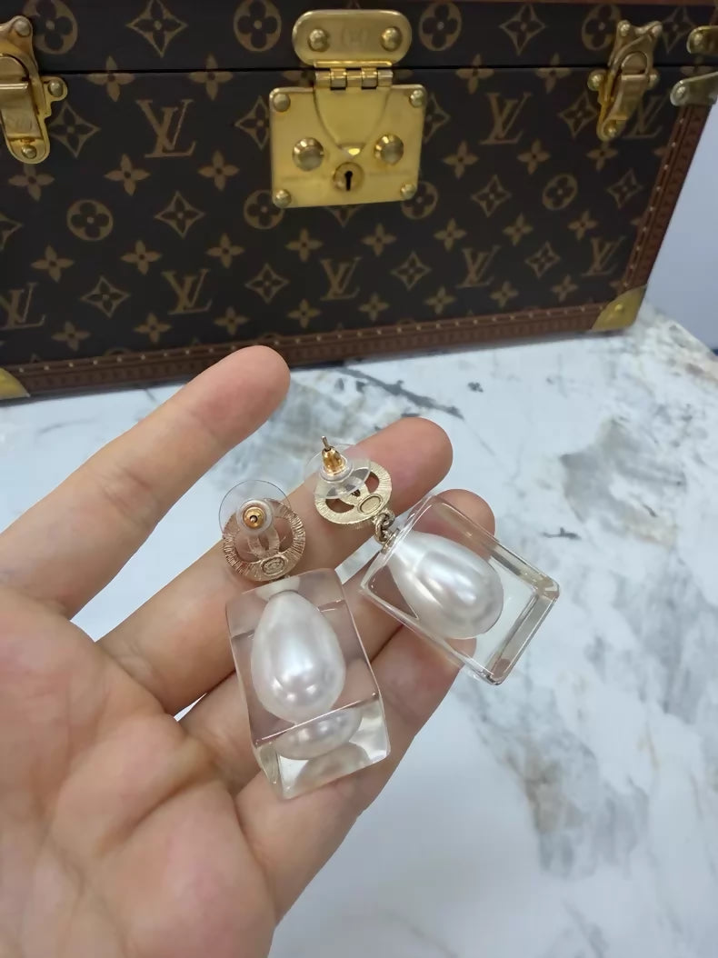 Chanel 19K gold pearl and acrylic earrings