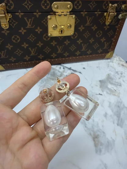 Chanel 19K gold pearl and acrylic earrings