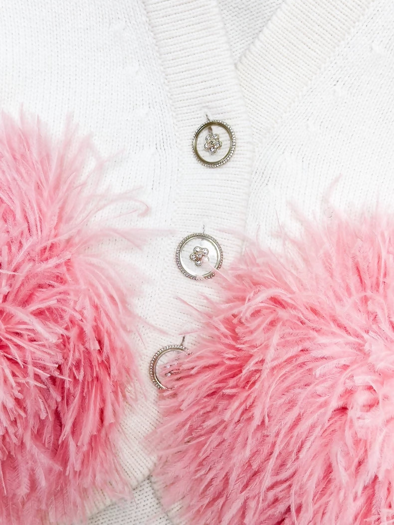 Chanel Fall/Winter 2023, white cashmere vest with pink ostrich feather