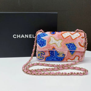 CHANEL 23A featuring colorful beaded sequins and heavy embroidery