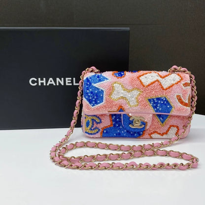 CHANEL 23A featuring colorful beaded sequins and heavy embroidery