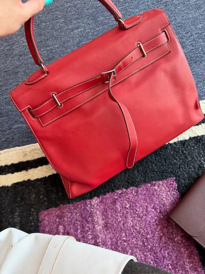 Hermes Flat Kelly 35 in red with white stitching.