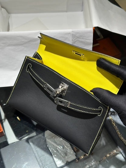 Hermes Kelly Pochette black swift leather with white stitching and yellow inside palladium hardware
